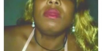 Goddess smoking and blowing smoke with big red lips