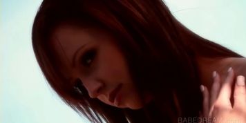 Sensual stripping moment with redhead dream babe