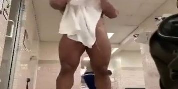 Muscular stud naked in locker room after showering