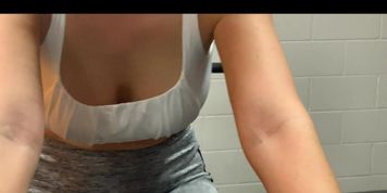 Wifey rides the exercise bike no bra (boobs swinging)