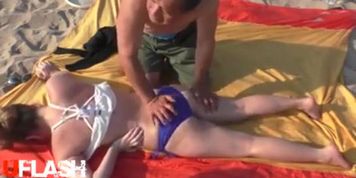 Massaging bare Breasts in public
