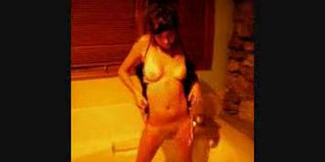 Nice girl playing on bed and in bath