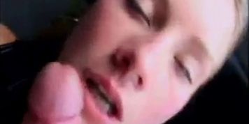 Blonde sucks off guy in a car