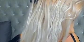 girl with cute face and a big pair of boobs shows off