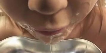 Bukkake girl drinks a wine glass full