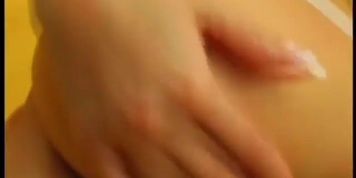 Solo model masturbating with a pink dildo (Julie Silver)