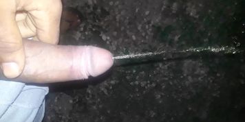 BBC pissing outdoors, stroking at end 