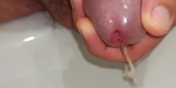 close up pissing and playing with peehole