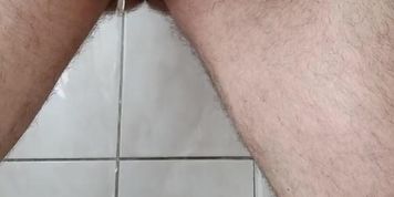 With two hands I roll the head of the penis and piss in the toilet.