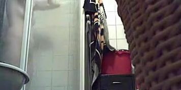 Bathroom spy cam records a blonde pissing and then showering