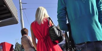 Blond in hot red suit darksome up petticoat