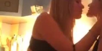 Two sexy girl teasing showing boobs and kissing