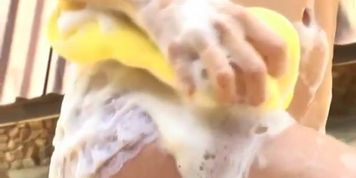 beautiful Asia model taked a bath outdoor