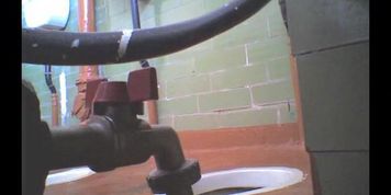 Girl in leather boots is getting spied pissing on toilet