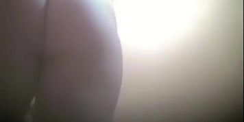 Big tits and hirsute cunt between stretched legs