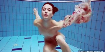 Underwater swimming in a dress by Martina