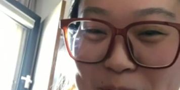 Chinese happy to finally light up her slim cigarette 