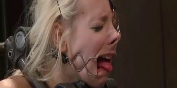 Two gorgeous blondes, both with different open mouth gags locked in bondage