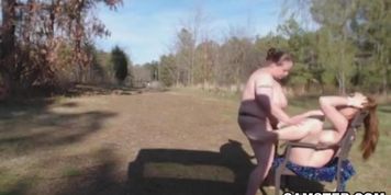 Lesbian anal strap on sex outdoors