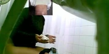 A fresh hottie is pissing in front of a toilet peeing spy cam