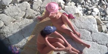 Cute young teen nudists on the beach