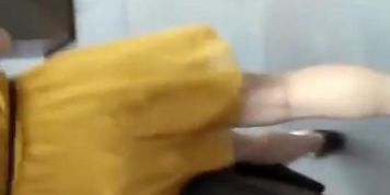 Woman in short yellow dress