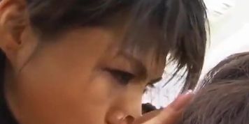 Asian spitdom licks his face until he gives in