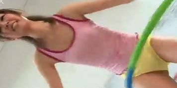 Sweet teen chick Chieri Minazuki is playing with a hula hoop