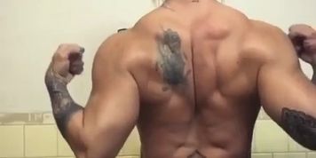 Fbb pumps & flexes her rough sexy back muscles in bathroom