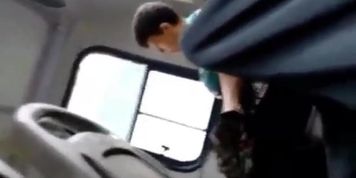 Woman Watches Bus Bulge