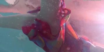 Redhead baby Nikita Vodorezova gets naked fast underwater