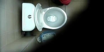 A hidden spy cam catches a chick pissing