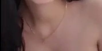 Sexy Latina seductively drinks alcohol 