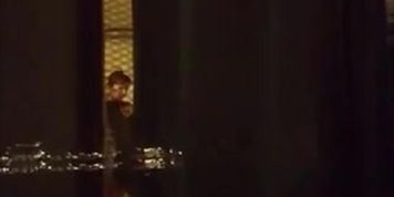 Window voyeur- brunette in bathroom