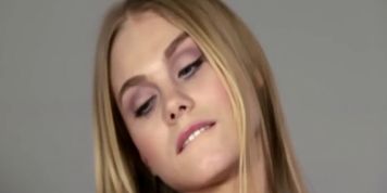 Gorgeous teen fingers her wet pussy wildly