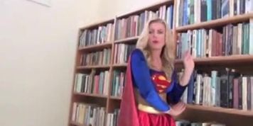 supergirl captured by a masked villainess in a black mini skirt & latex bra