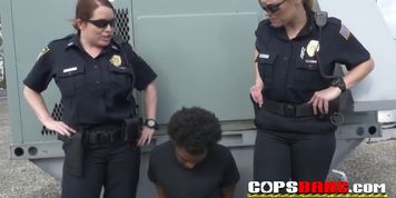 MILFs are taking a black criminal into custody to suck his black shlong