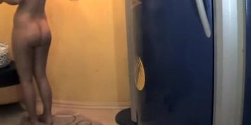 Spying a naked lady in a tanning booth