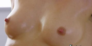 Oiled lesbians pussyfingering each other