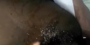 Hairy black pussy flushing out nicely