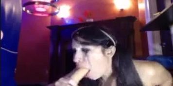 Latina Sucks Her Squirting Dildo On Cam