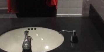 Busty teen plays with tits at work