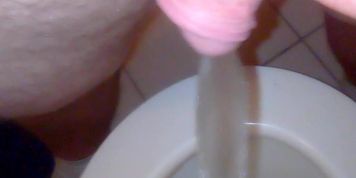 Chubby boy piss on toilet
