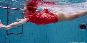 Sexy naked twat Avenna swims nude in the pool