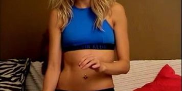 Blonde teases on bed