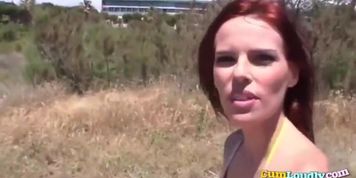 Redhead sweetie in sting bikini