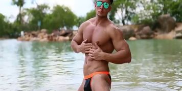 Sexy muscle guy on beach