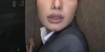 Shocked office lady in the elevator
