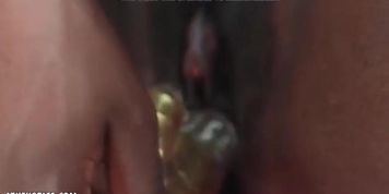 Young black woman has golden vibrator for self-fucking