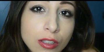 Gorgeous young brunette girl giving sexy smoking dildo blowjob